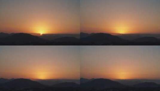 群山日落延时唯美夕阳黄昏橙色天空太阳下山高清在线视频素材下载
