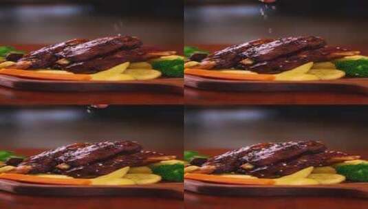竖屏西餐美食烤肋排撒芝麻高清在线视频素材下载