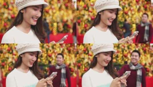 圣诞快乐，新年快乐。圣诞节的年轻亚洲夫妇高清在线视频素材下载