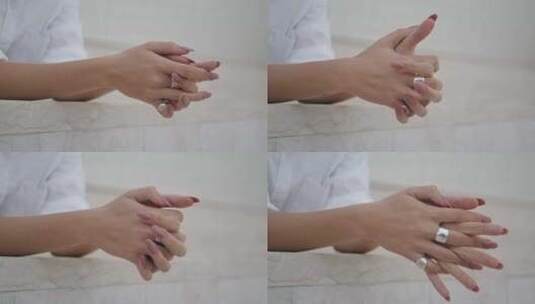 女人双手交叉手指与时尚戒指特写高清在线视频素材下载