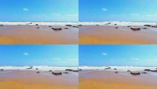 海南省万宁市山钦湾蓝天白云下沙滩海浪浪花高清在线视频素材下载