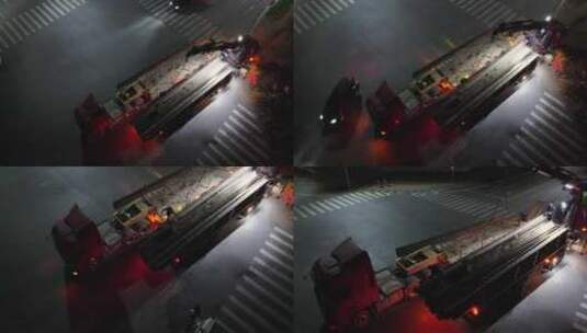 大货车转运钢板夜景航拍高清在线视频素材下载