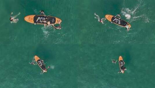 鸟瞰水上摩托车刺激和宁静的滑翔伞海滨氛围高清在线视频素材下载