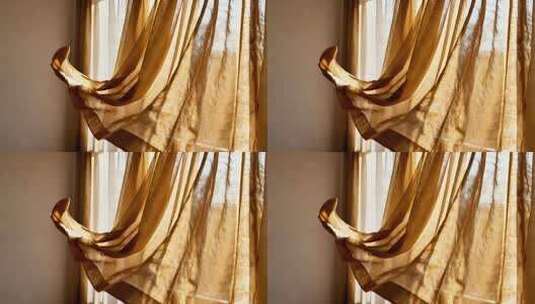 阳光投射在飘动的室内窗帘高清在线视频素材下载