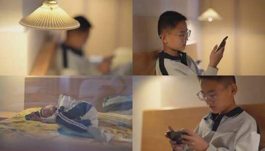 夜晚孩子玩手机成瘾高清在线视频素材下载