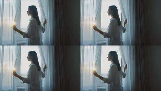 女子室内拉开窗帘迎阳光高清在线视频素材下载