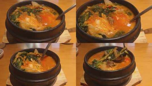 韩餐馆餐桌上新鲜出炉的小白菜牛排骨汤美食高清在线视频素材下载