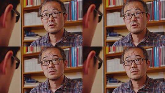 中年亚洲商务人士正在办公室认真倾听高清在线视频素材下载