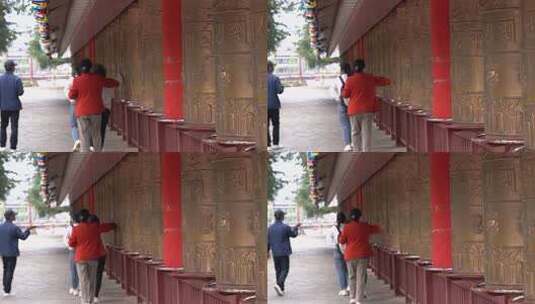 4K藏族宗教仪式游客在转经轮高清在线视频素材下载