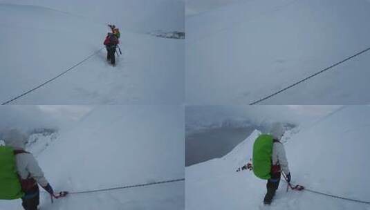 风雪中攀登四川贡嘎山区贡巴峰的登山者高清在线视频素材下载