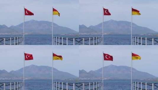 港口的两面旗帜在空中飘扬高清在线视频素材下载
