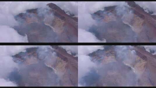 航拍云雾环绕的火山口高清在线视频素材下载
