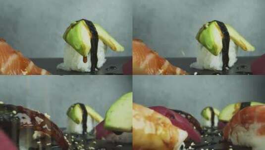 在寿司上撒上芝麻特写镜头高清在线视频素材下载