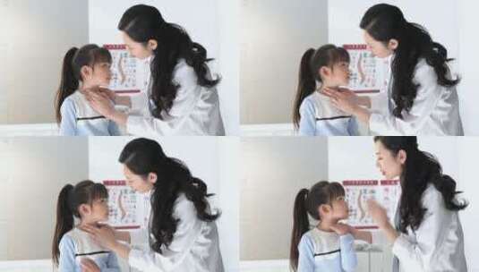 年轻女医生给小女孩检查身体高清在线视频素材下载