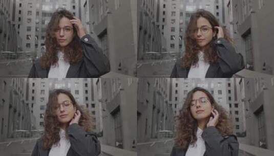 女人整理了一下头发和眼镜高清在线视频素材下载