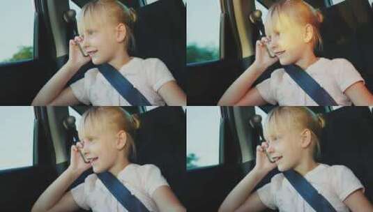 女孩坐在汽车上系着安全带打电话高清在线视频素材下载