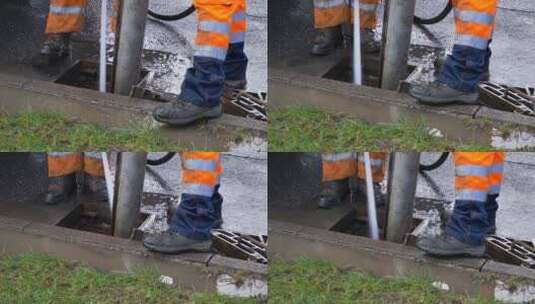 排水工人试图清理排水沟时脚的高角度拍摄高清在线视频素材下载