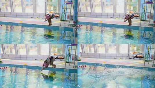 在泳池练习跳水出发游泳的中国女孩高清在线视频素材下载