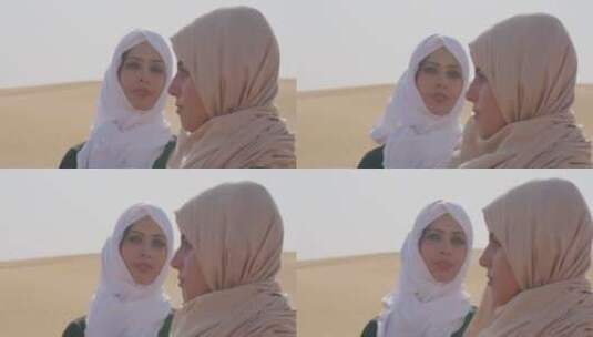 穆斯林父母在沙漠中拍摄高清在线视频素材下载