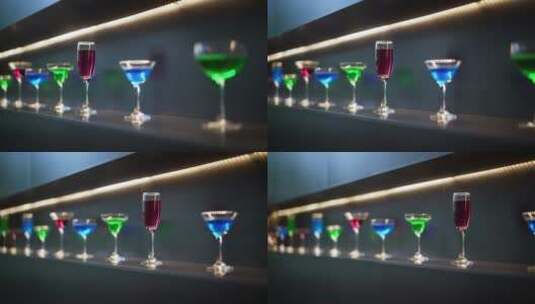 吧台上各种颜色鸡尾酒的玻璃杯高清在线视频素材下载