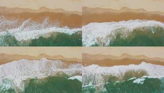 4k鸟瞰海浪沿着海岸拍成泡沫高清在线视频素材下载