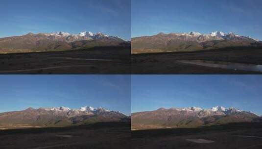 航拍日照金山的雪山高清在线视频素材下载