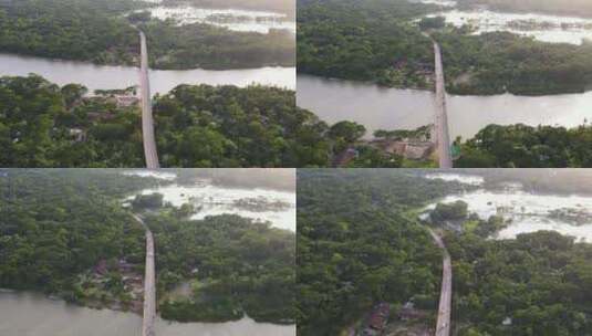 连接森林河岸的高空桥梁，背景中的湿地。孟加拉国高清在线视频素材下载