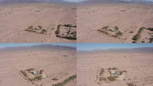 加州空旷的莫哈韦沙漠中一所孤独的房子的下降特写平移航拍。4K高清在线视频素材下载