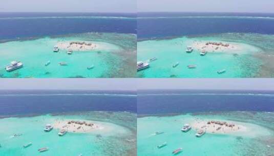 天堂岛上的游客游览田园诗般的珊瑚岛，卡约竞技场；空中高清在线视频素材下载