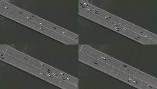 空中放大在黑暗的海水上直接越过库克船长桥的繁忙公路桥高速公路高清在线视频素材下载
