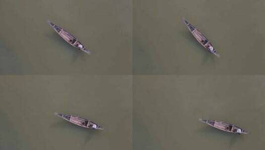 在伊查马蒂河上漂浮的传统木船上俯瞰孤独渔夫高清在线视频素材下载