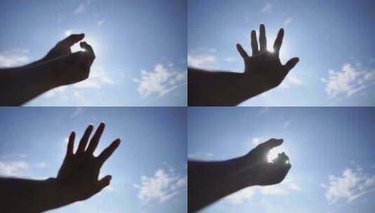 手握阳光穿过指缝手握住拳头伸手遮住太阳光高清在线视频素材下载