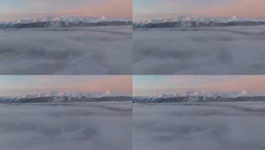 航拍冬季清晨的新疆喀纳斯雪景和日照金山高清在线视频素材下载