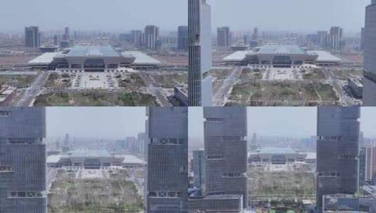 郑州东站后飞见高楼大厦双子塔高清在线视频素材下载