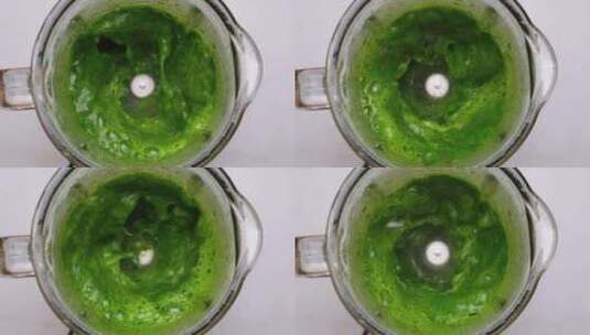 在搅拌机中烹饪绿色蔬菜冰沙菠菜叶在搅拌机高清在线视频素材下载
