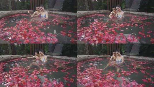 情侣在花瓣温泉中享受浪漫时光高清在线视频素材下载