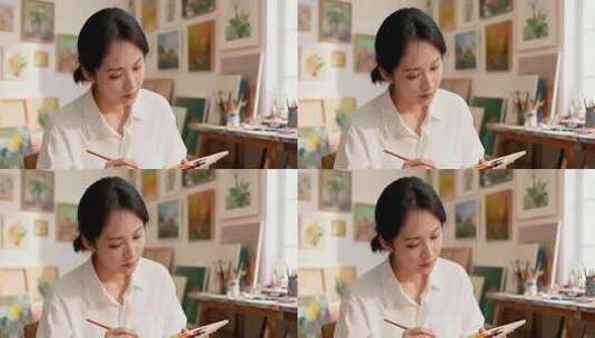 女性在画室专注作画素材高清在线视频素材下载
