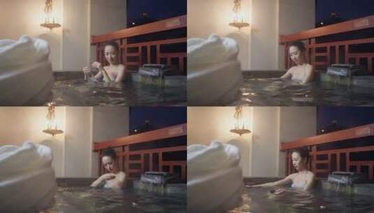 女子在温泉中放松身心高清在线视频素材下载