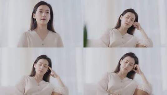 女性居家闭眼揉太阳穴画面高清在线视频素材下载