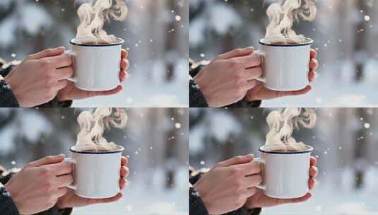 手持热饮在雪景中高清在线视频素材下载