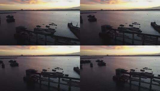 海港夕阳下停泊的渔船高清在线视频素材下载