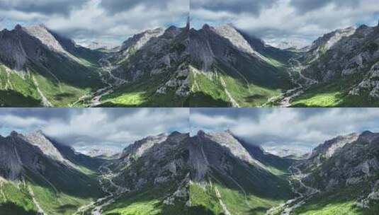 蓝天白云下甘南扎尕那的山脉和山谷中的公路高清在线视频素材下载