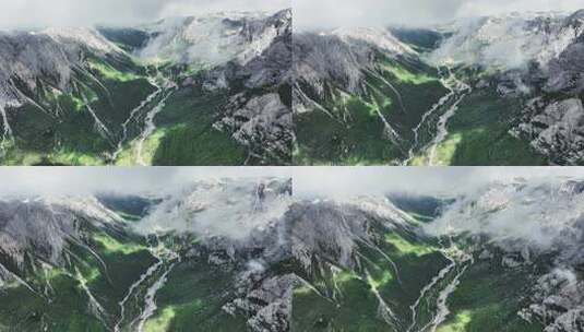 蓝天白云下甘南扎尕那的山脉和山谷中的公路高清在线视频素材下载