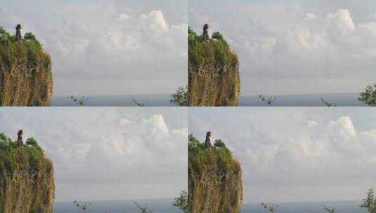 女人站在悬崖上看风景高清在线视频素材下载