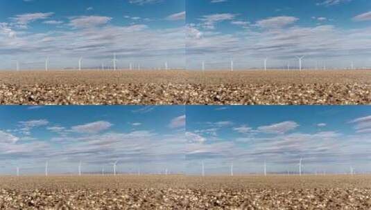 青海戈壁上的风力发电大风车延时高清在线视频素材下载