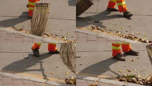 环卫工人清扫马路边的落叶高清在线视频素材下载