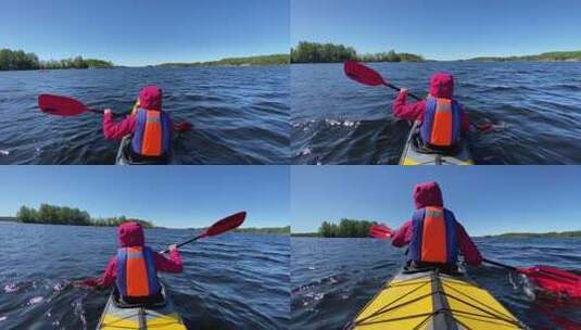 人划运动皮划艇沿着湖水在蓝天高清在线视频素材下载