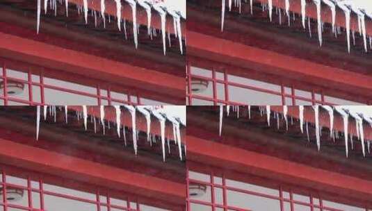 4K红色建筑上的冰柱子雪花慢镜高清在线视频素材下载