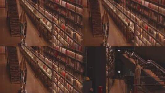 4K 高质感艺术书店男子行走看书高清在线视频素材下载