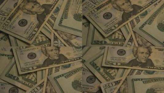 美国鹰盾背景上美国纸币的旋转镜头-MONEY 0398高清在线视频素材下载